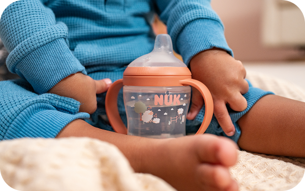 Baby with NUK sippy cup