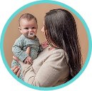 [Translate to Spanish (Reborn):] Mother with Baby and soother