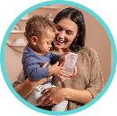 [Translate to Spanish (Reborn):] Mother with Baby and Learner bottle