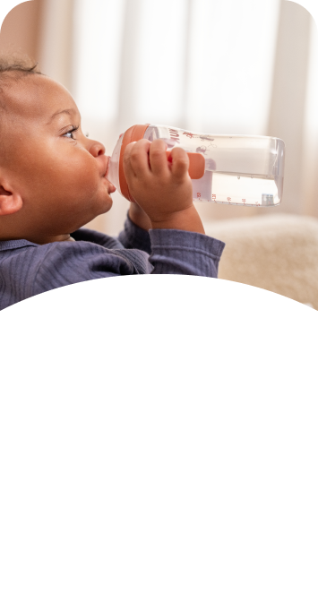 [Translate to Spanish (Reborn):] Baby with Learner bottle