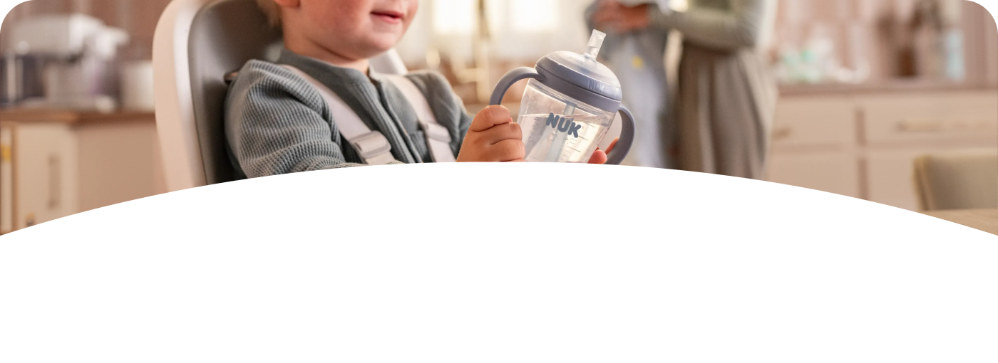 [Translate to Spanish (Reborn):] Baby with Learner Bottle Straw