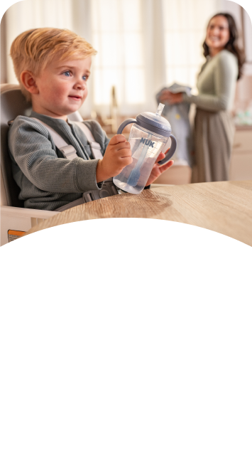 [Translate to Spanish (Reborn):] Baby with Learner Bottle Straw