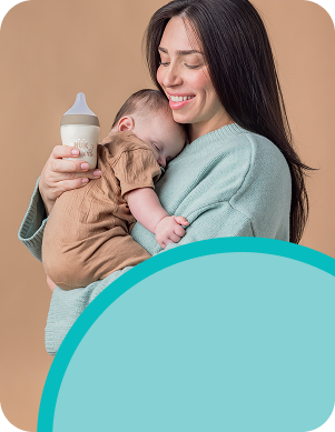 [Translate to Spanish (Reborn):] Mother with Baby and Baby bottle