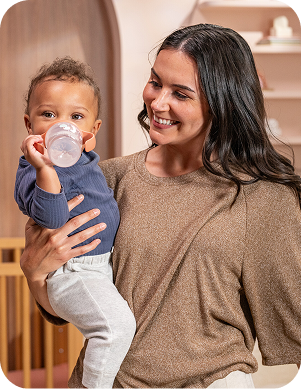 [Translate to Spanish (Reborn):] Mother with Baby and Learner bottle