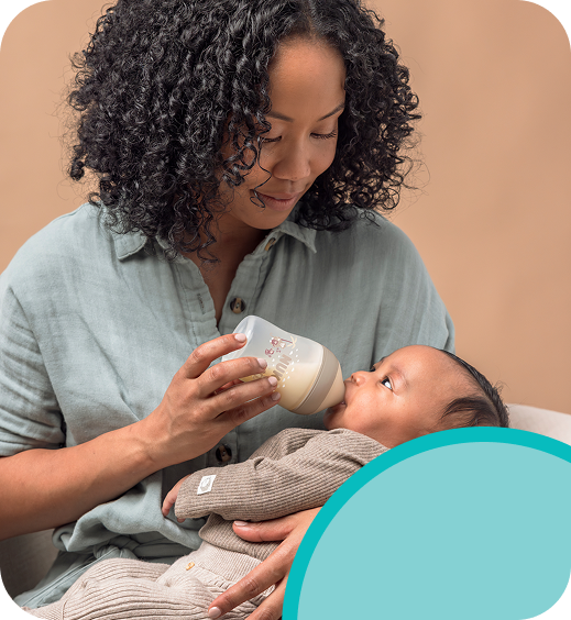 [Translate to Spanish (Reborn):] Mother with Baby and baby bottle