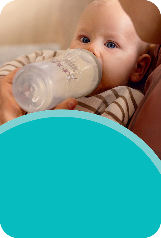 [Translate to Spanish (Reborn):] Baby with Baby bottle