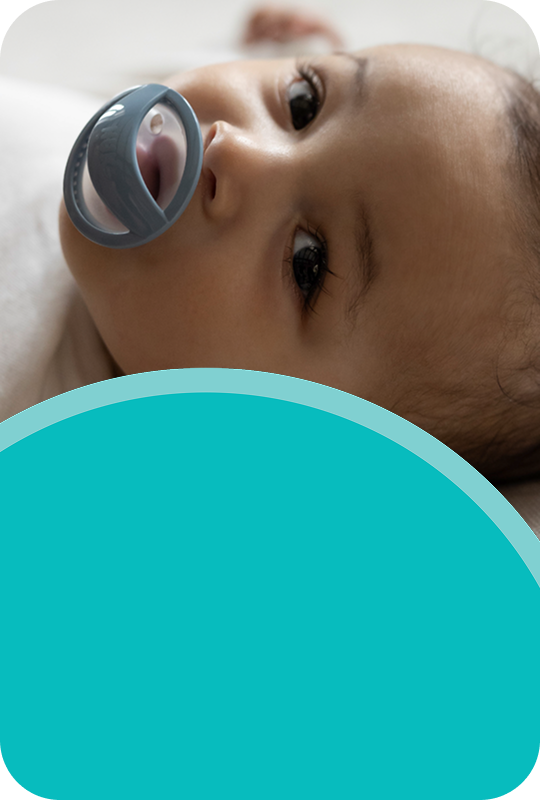 [Translate to Spanish (Reborn):] Baby with soother