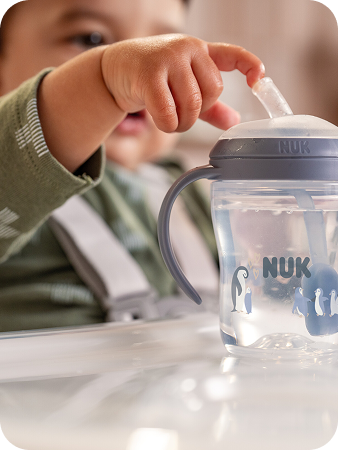 [Translate to Spanish (Reborn):] Baby with Learner straw